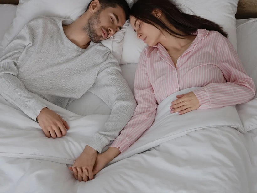 Couple holding hands during a quiet moment of the relationship.