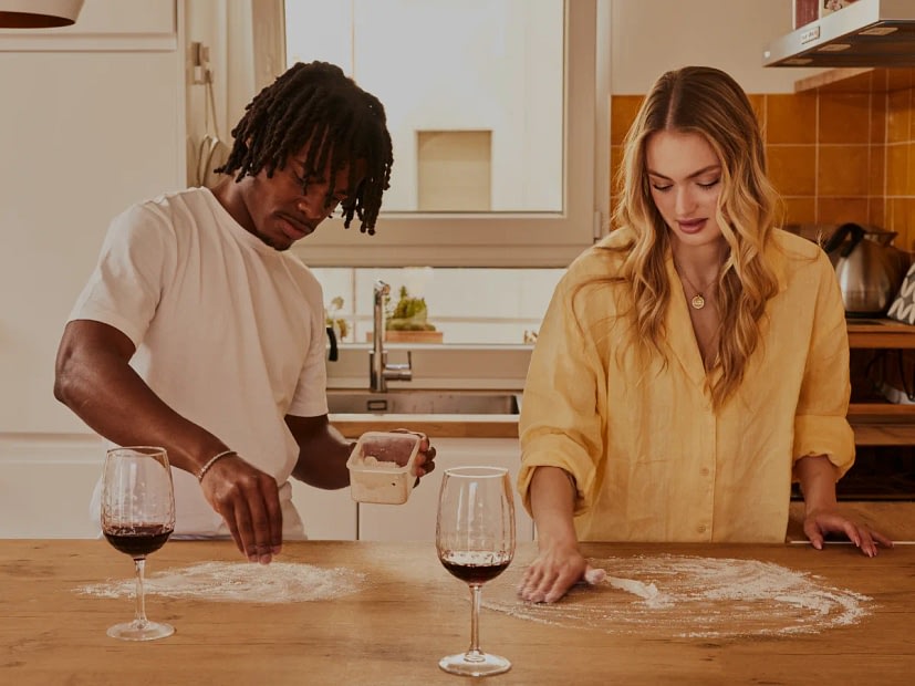 Couple cooking dinner together